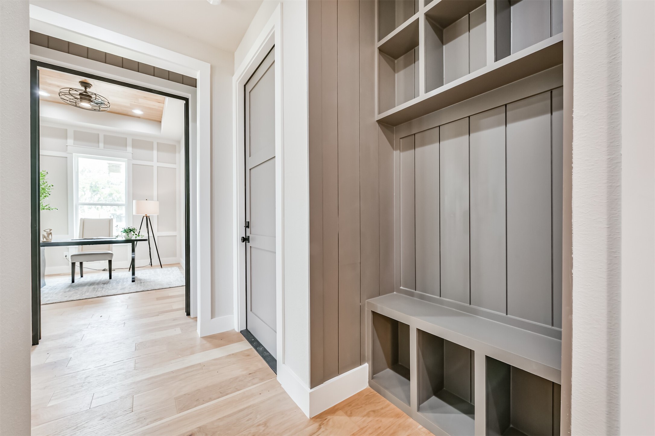 250 Pony Trail Angleton, TX 77515 - Photo 14 of 32 This organized mudroom offers practical storage solutions with built-in cubbies and hooks, seamlessly combining style and functionality.