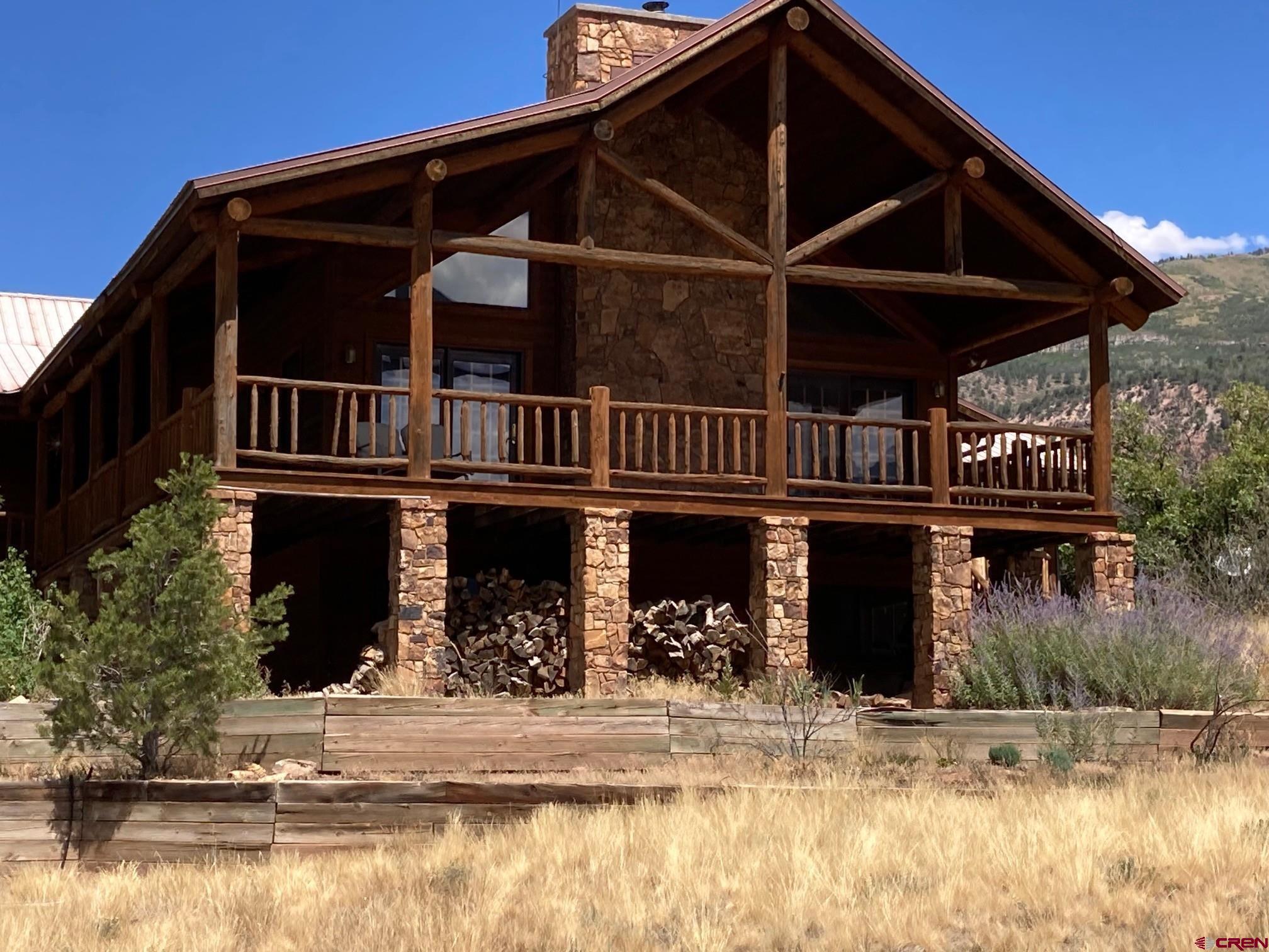 2692 County Road 17 Ridgway, CO 81432 - Photo 2 of 10 a front view of a house with street