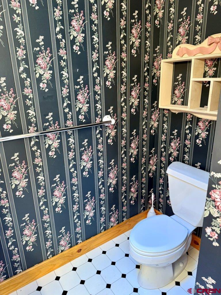 2692 County Road 17 Ridgway, CO 81432 - Photo 10 of 10 a bathroom with a toilet and shower curtain