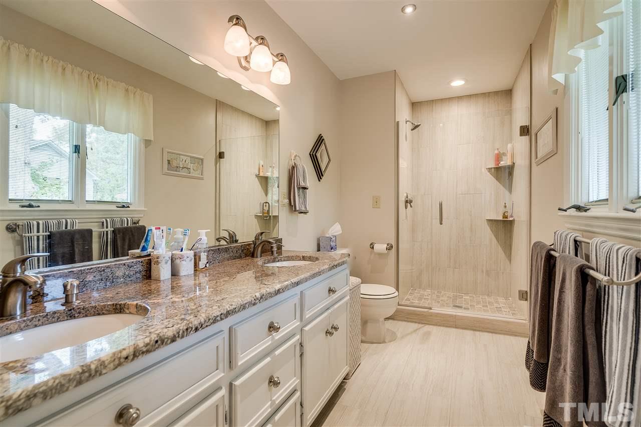 5 Chippers Way Durham, NC 27705 - Photo 13 of 25 Updated walk in shower with frameless door, New fixtures, granite counters, flooring!