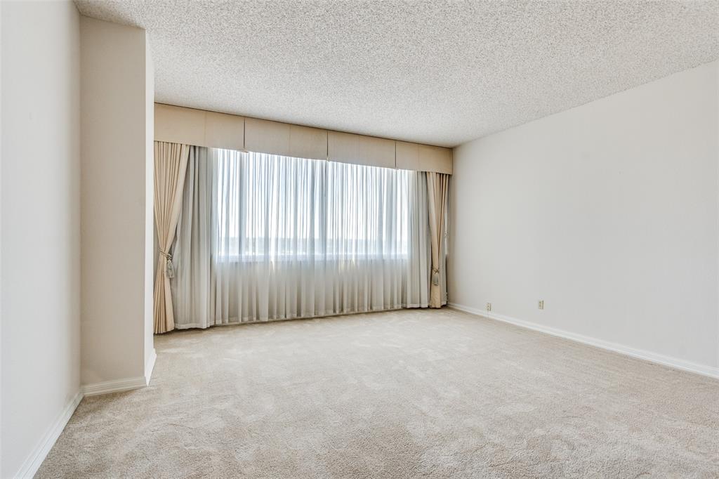 5200 Keller Springs Road, Unit 820 Dallas, TX 75248 - Photo 16 of 40 an empty room with a window