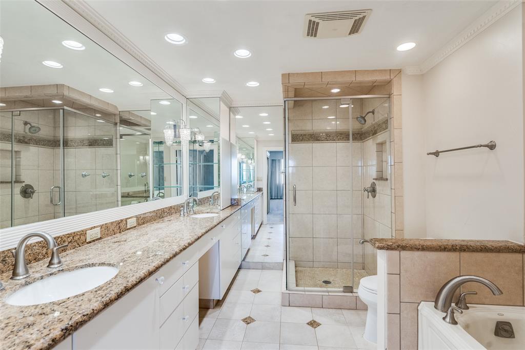 5200 Keller Springs Road, Unit 820 Dallas, TX 75248 - Photo 19 of 40 a bathroom with a granite countertop sink mirror and shower