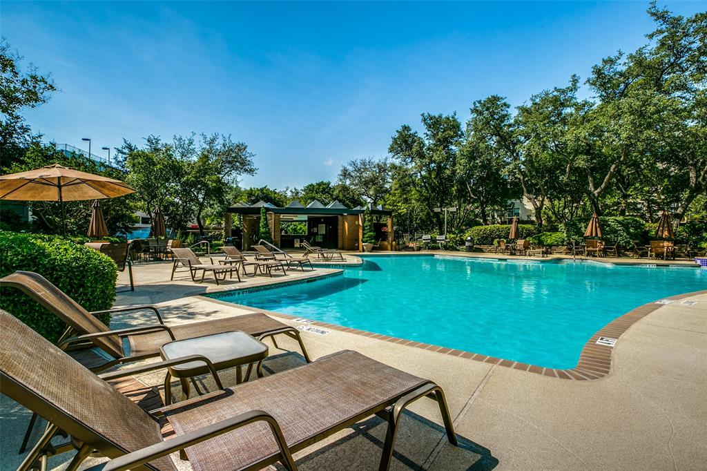 5200 Keller Springs Road, Unit 820 Dallas, TX 75248 - Photo 25 of 40 a view of a swimming pool and lounge chairs
