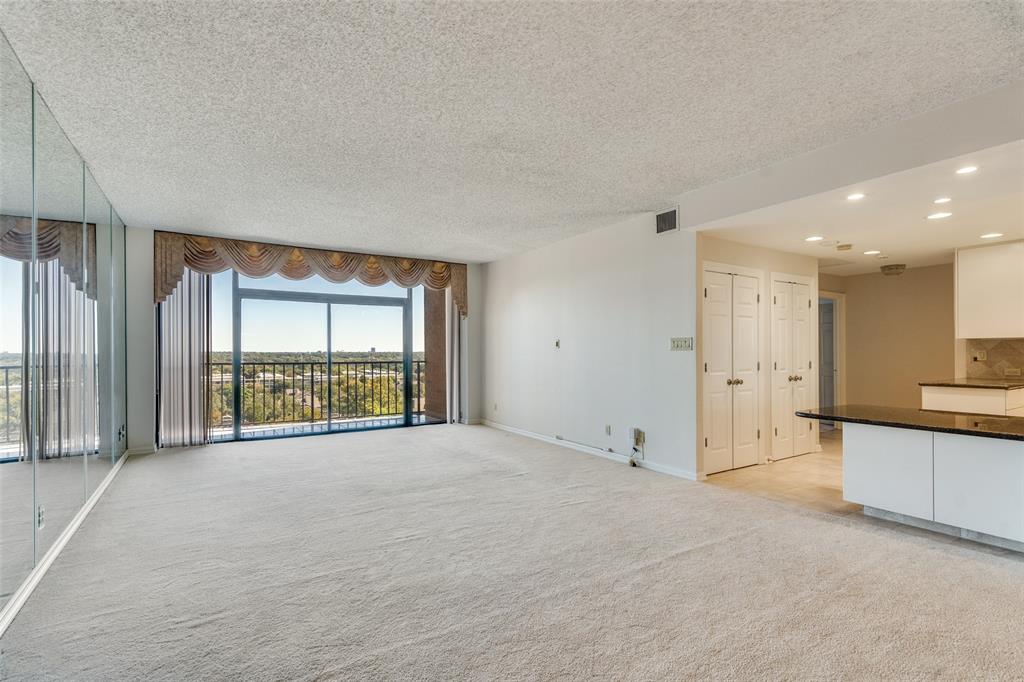 5200 Keller Springs Road, Unit 820 Dallas, TX 75248 - Photo 3 of 40 a view of an empty room with a window