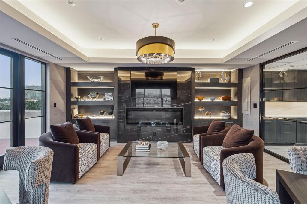 5200 Keller Springs Road, Unit 820 Dallas, TX 75248 - Photo 37 of 40 a living room with furniture a rug potted plant and a window