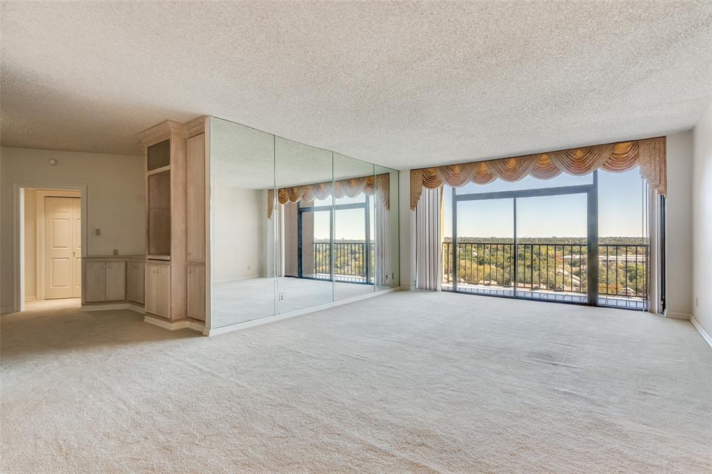 5200 Keller Springs Road, Unit 820 Dallas, TX 75248 - Photo 4 of 40 a view of an empty room with a window