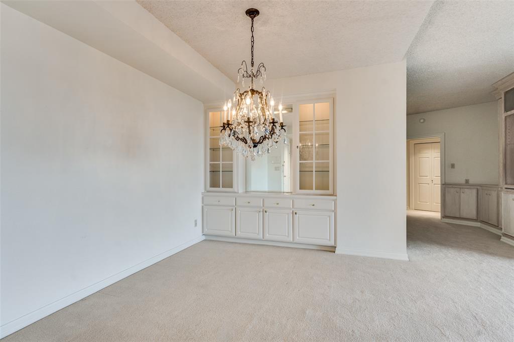 5200 Keller Springs Road, Unit 820 Dallas, TX 75248 - Photo 8 of 40 a view of a chandelier in a room