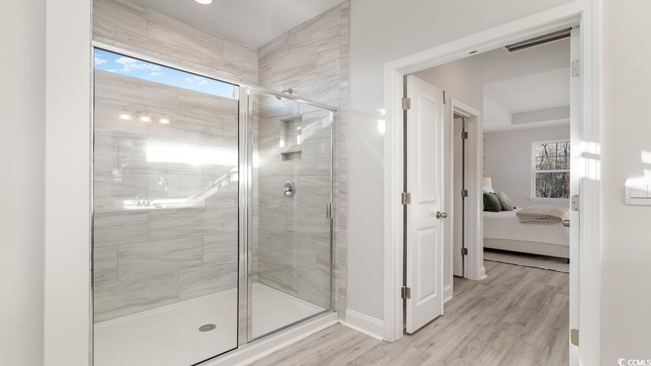 125 Fair Meadow Loris, SC 29569 - Photo 26 of 26 Bathroom featuring a shower with door and hardwood / wood-style floors
