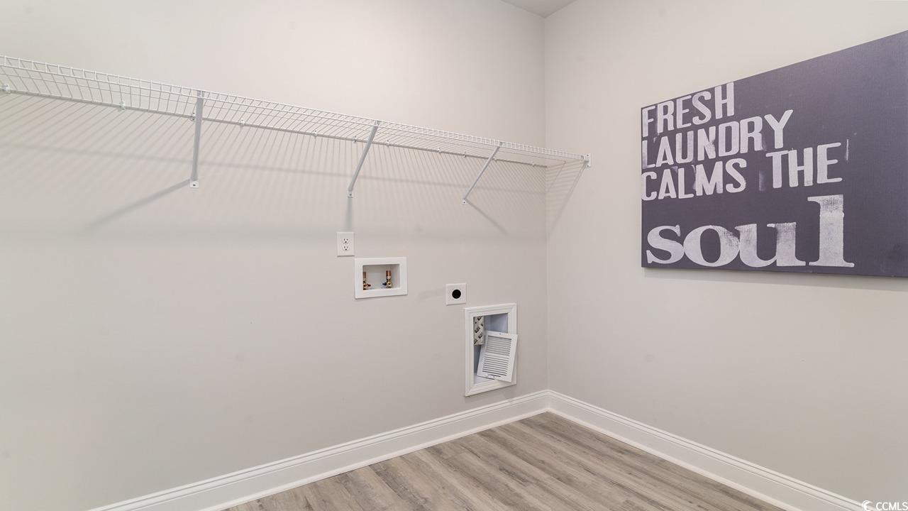 125 Fair Meadow Loris, SC 29569 - Photo 10 of 26 Washroom with hookup for a washing machine, electric dryer hookup, and hardwood / wood-style floors