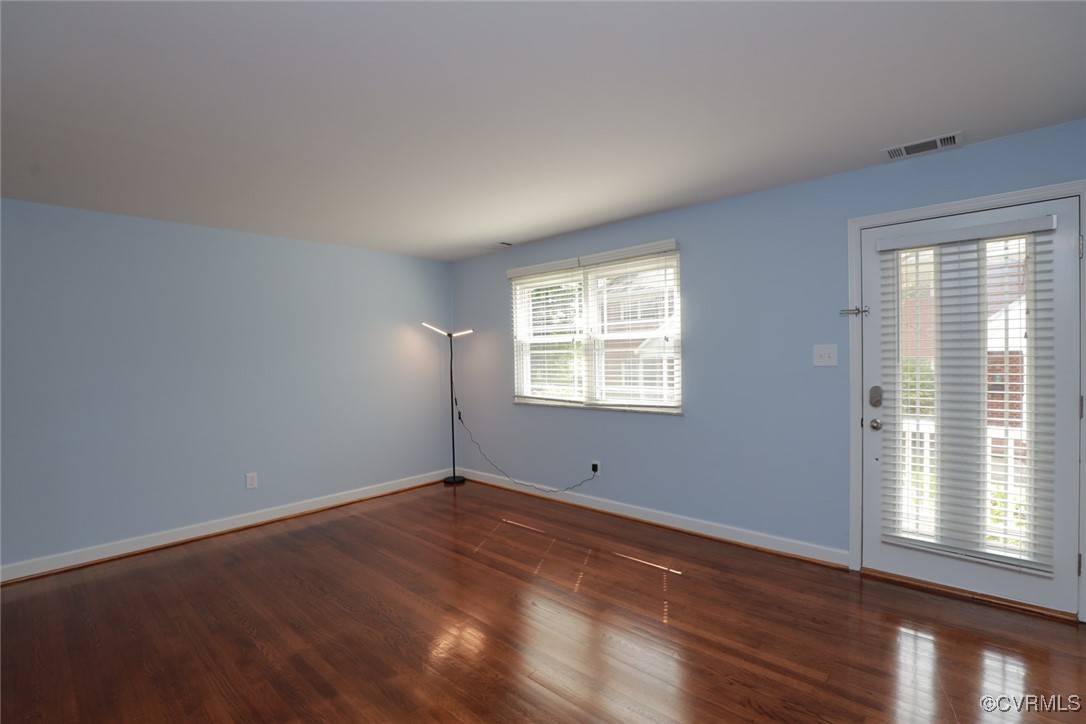 3109 North Parham Road, Unit 40 Henrico, VA 23294 - Photo 11 of 40 an empty room with wooden floor and windows