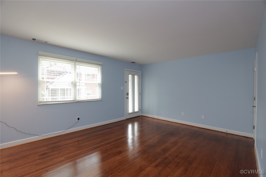 3109 North Parham Road, Unit 40 Henrico, VA 23294 - Photo 12 of 40 a view of an empty room with wooden floor and a window