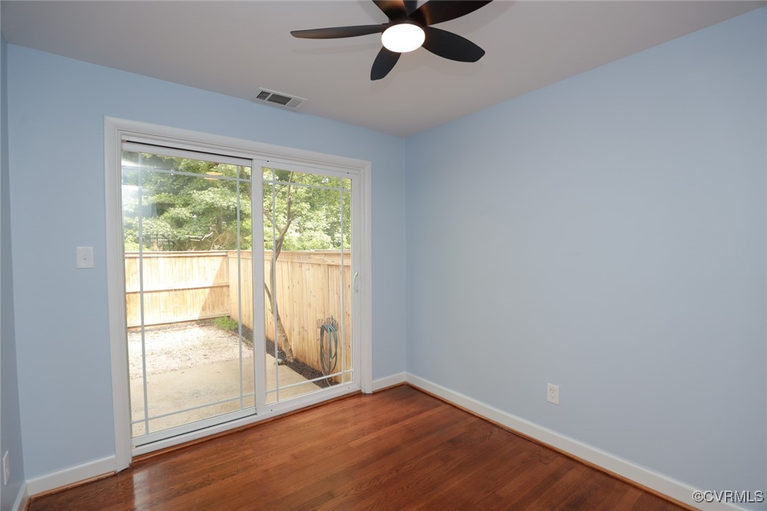 3109 North Parham Road, Unit 40 Henrico, VA 23294 - Photo 16 of 40 an empty room with wooden floor and windows