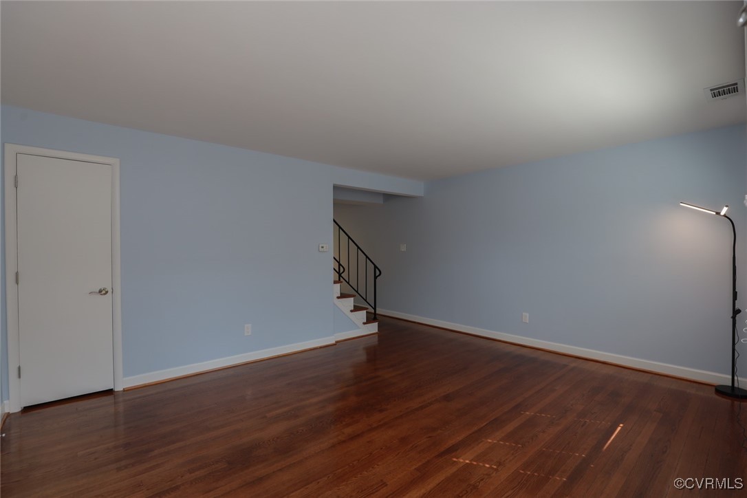 3109 North Parham Road, Unit 40 Henrico, VA 23294 - Photo 9 of 40 a view of an empty room with wooden floor and fan