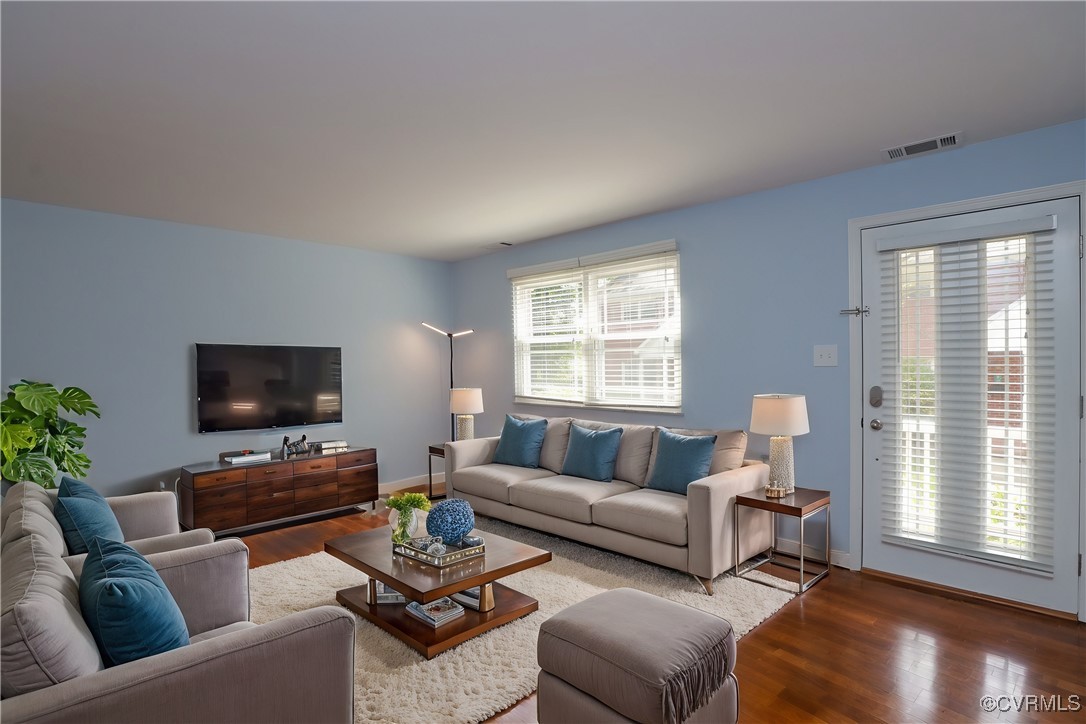 3109 North Parham Road, Unit 40 Henrico, VA 23294 - Photo 10 of 40 a living room with furniture and a flat screen tv with wooden floor