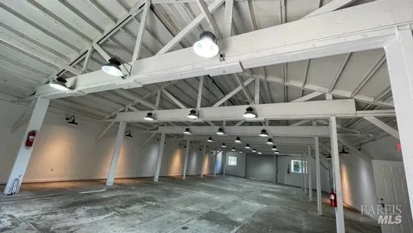 a view of a room with lots of shower and wooden floor
