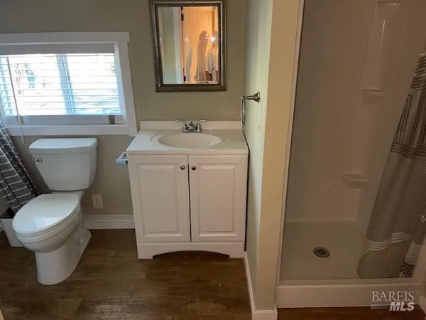 a kitchen with granite countertop a sink and a stove