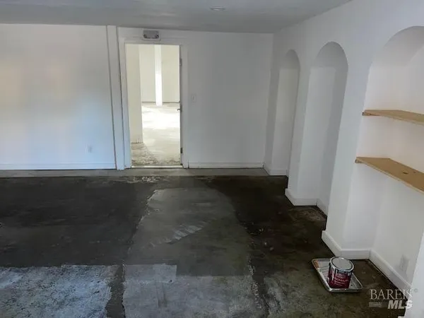 a view of a porch with wooden floor and a swimming pool
