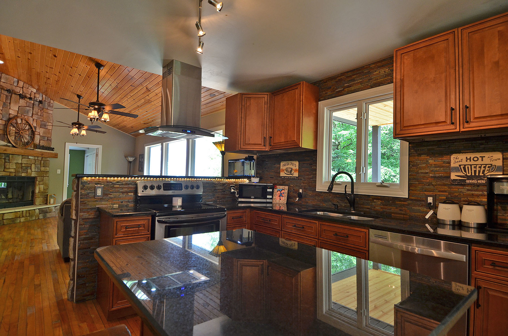 2580 East 1251st Road Ottawa, IL 61350 - Photo 13 of 29 a kitchen with stainless steel appliances granite countertop a sink stove and cabinets