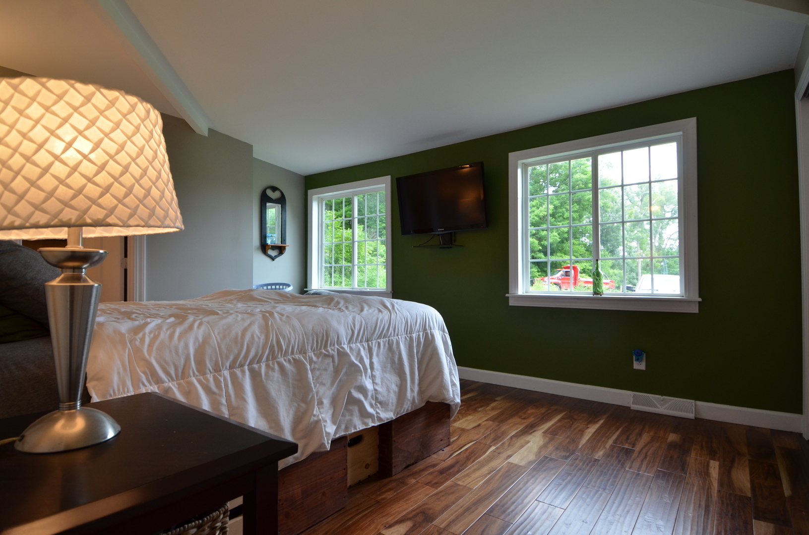 2580 East 1251st Road Ottawa, IL 61350 - Photo 18 of 29 a bed sitting in a bedroom next to a window
