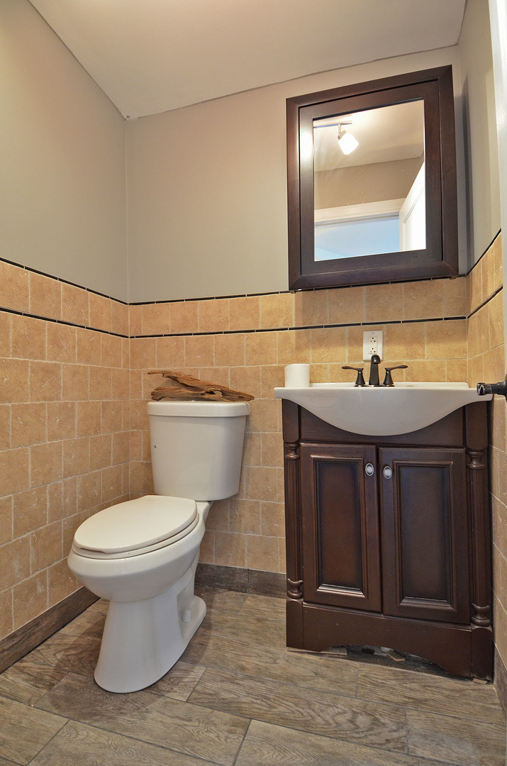2580 East 1251st Road Ottawa, IL 61350 - Photo 21 of 29 a bathroom with a toilet sink and mirror