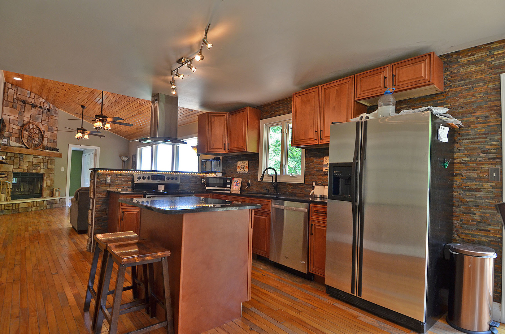 2580 East 1251st Road Ottawa, IL 61350 - Photo 5 of 29 a kitchen with refrigerator and chairs