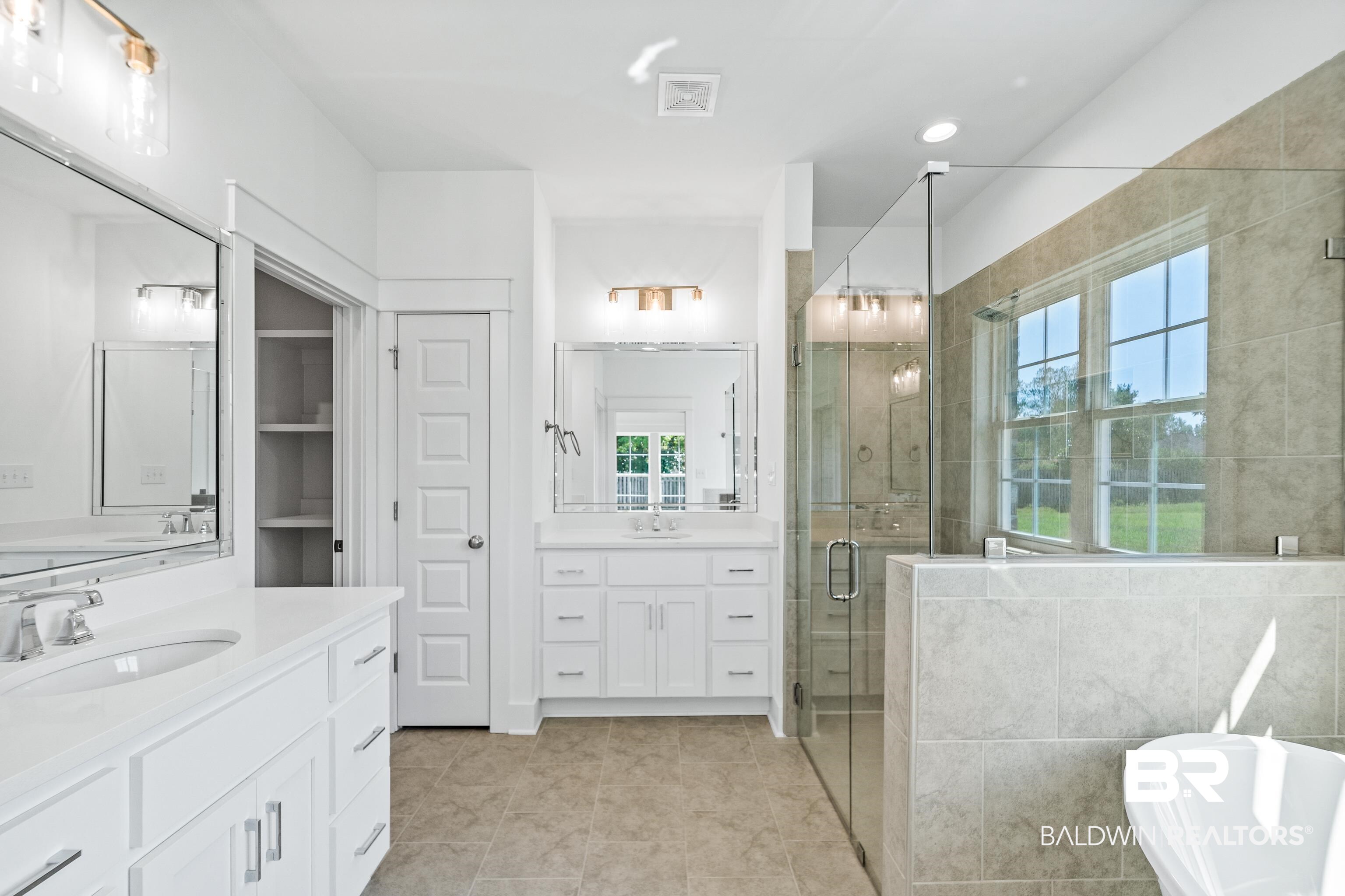 25927 Capra Court Daphne, AL 36526 - Photo 19 of 37 Bathroom with tile patterned flooring, vanity, separate shower and tub, and a wealth of natural light