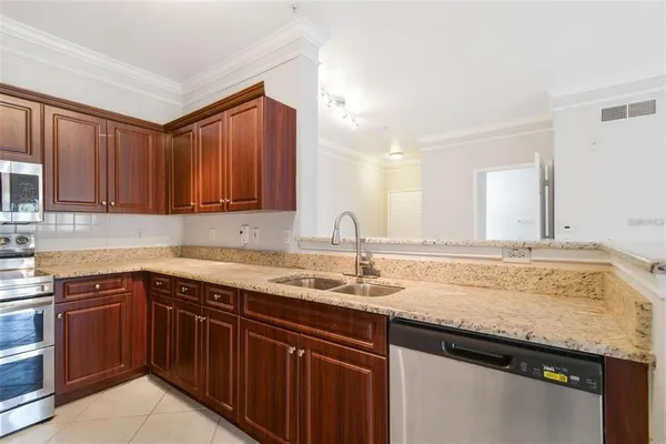 a kitchen with a sink and cabinets