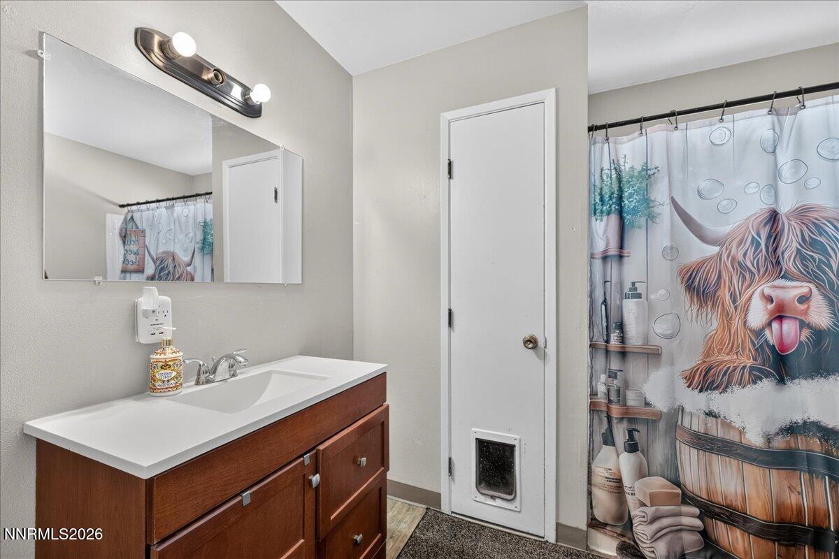 5 Smithridge Park Reno, NV 89502 - Photo 18 of 24 a bathroom with a sink vanity and a mirror