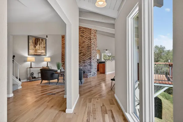 a view of a dining room with furniture window and wooden floor