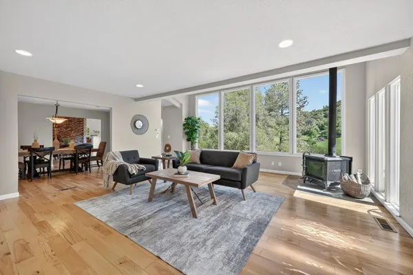 a living room with furniture fireplace and flat screen tv