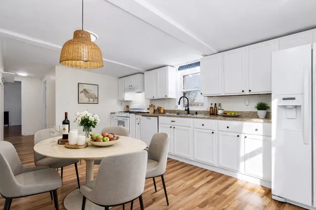a bathroom with a sink a mirror and a window