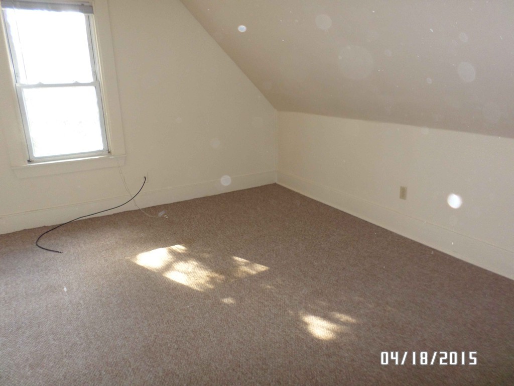 265-267 Water Street Springfield, MA 01151 - Photo 12 of 23 a view of a big room with windows and chandelier