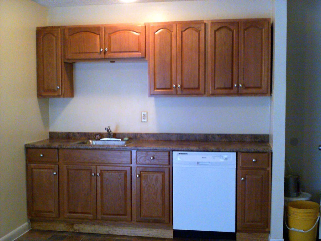 265-267 Water Street Springfield, MA 01151 - Photo 2 of 23 a kitchen with stainless steel appliances granite countertop a stove and a wooden cabinets