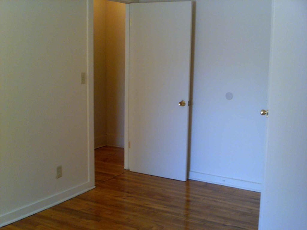265-267 Water Street Springfield, MA 01151 - Photo 7 of 23 a view of an empty room with wooden floor
