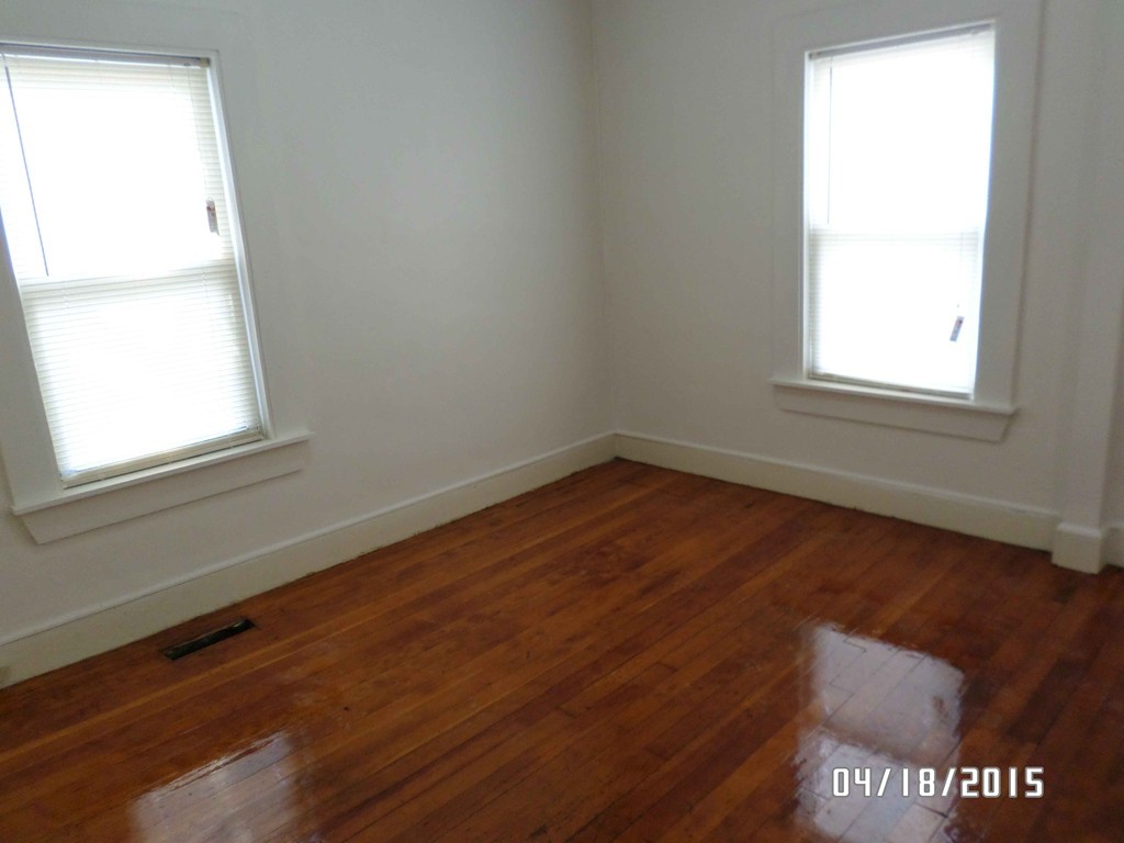 265-267 Water Street Springfield, MA 01151 - Photo 10 of 23 an empty room with wooden floor and windows