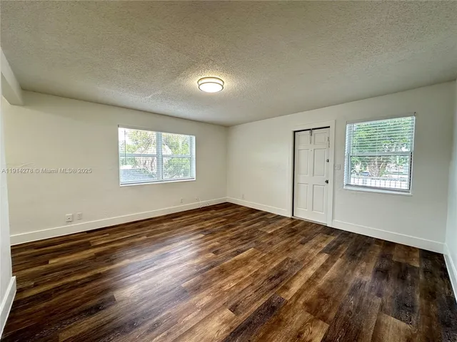a view of an empty room and window
