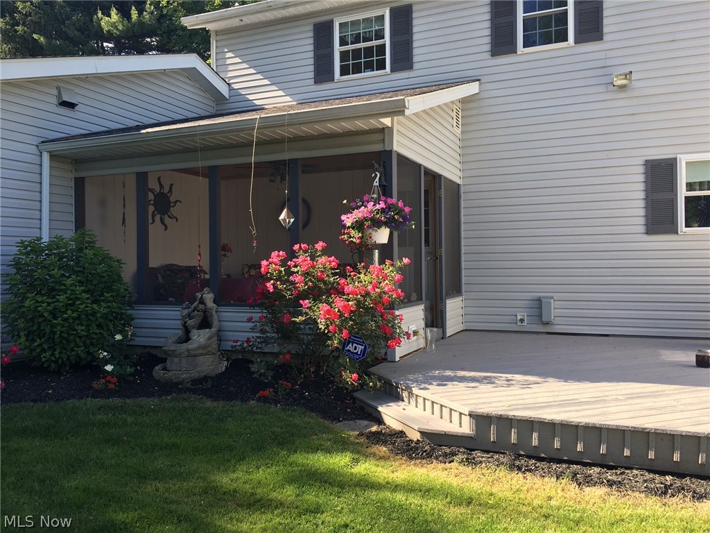 4262 Force Road Shreve, OH 44676 - Photo 29 of 31 Relaxing Screened porch and deck with beautiful landscaping.