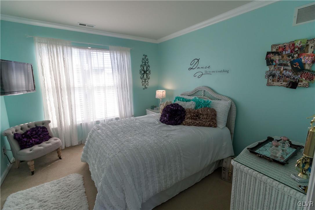 8785 Pathfinder Road Breinigsville, PA 18031 - Photo 19 of 28 3rd bedroom with walk-in closet and crown molding.