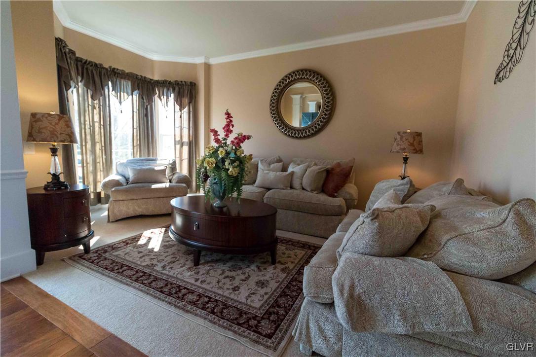 8785 Pathfinder Road Breinigsville, PA 18031 - Photo 3 of 28 Formal living room with crown molding and bump out