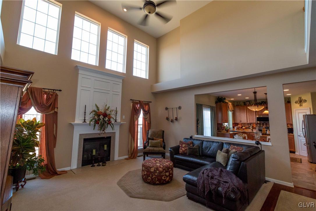 8785 Pathfinder Road Breinigsville, PA 18031 - Photo 5 of 28 2-story family room with remote operated gas firep
