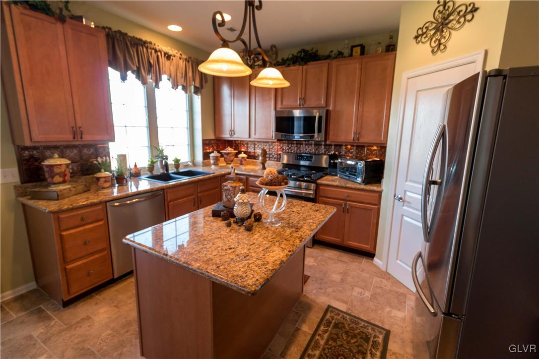 8785 Pathfinder Road Breinigsville, PA 18031 - Photo 7 of 28 Granite counters, stainless steel appliances, 42"