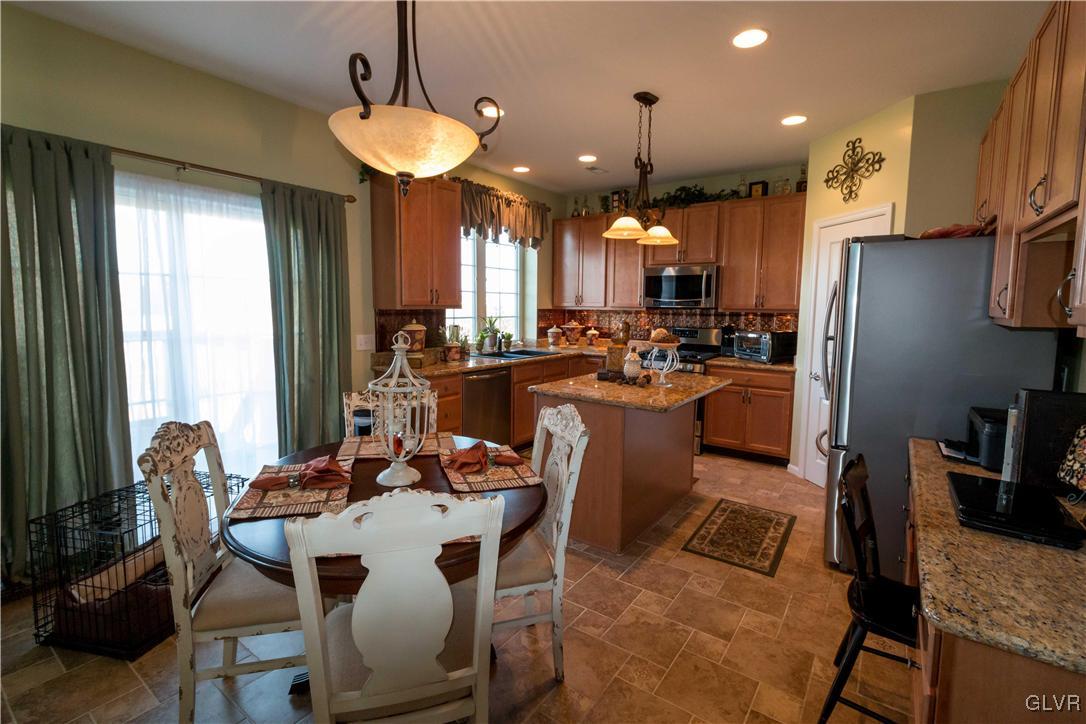 8785 Pathfinder Road Breinigsville, PA 18031 - Photo 8 of 28 Casual eating area and sliding door to romantic pr
