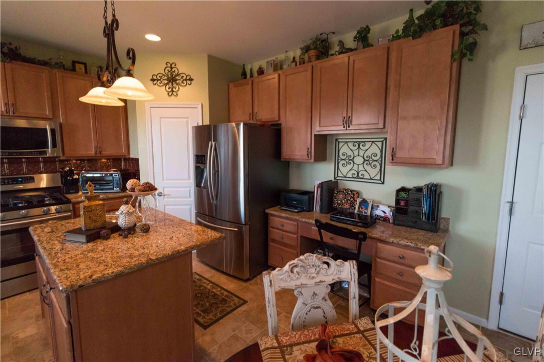 8785 Pathfinder Road Breinigsville, PA 18031 - Photo 10 of 28 Granite topped center island gives additional stor
