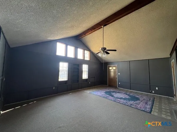 a view of a hallway with windows