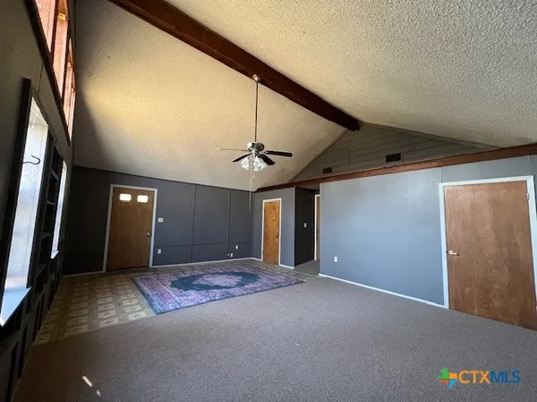 a view of a livingroom with a staircase