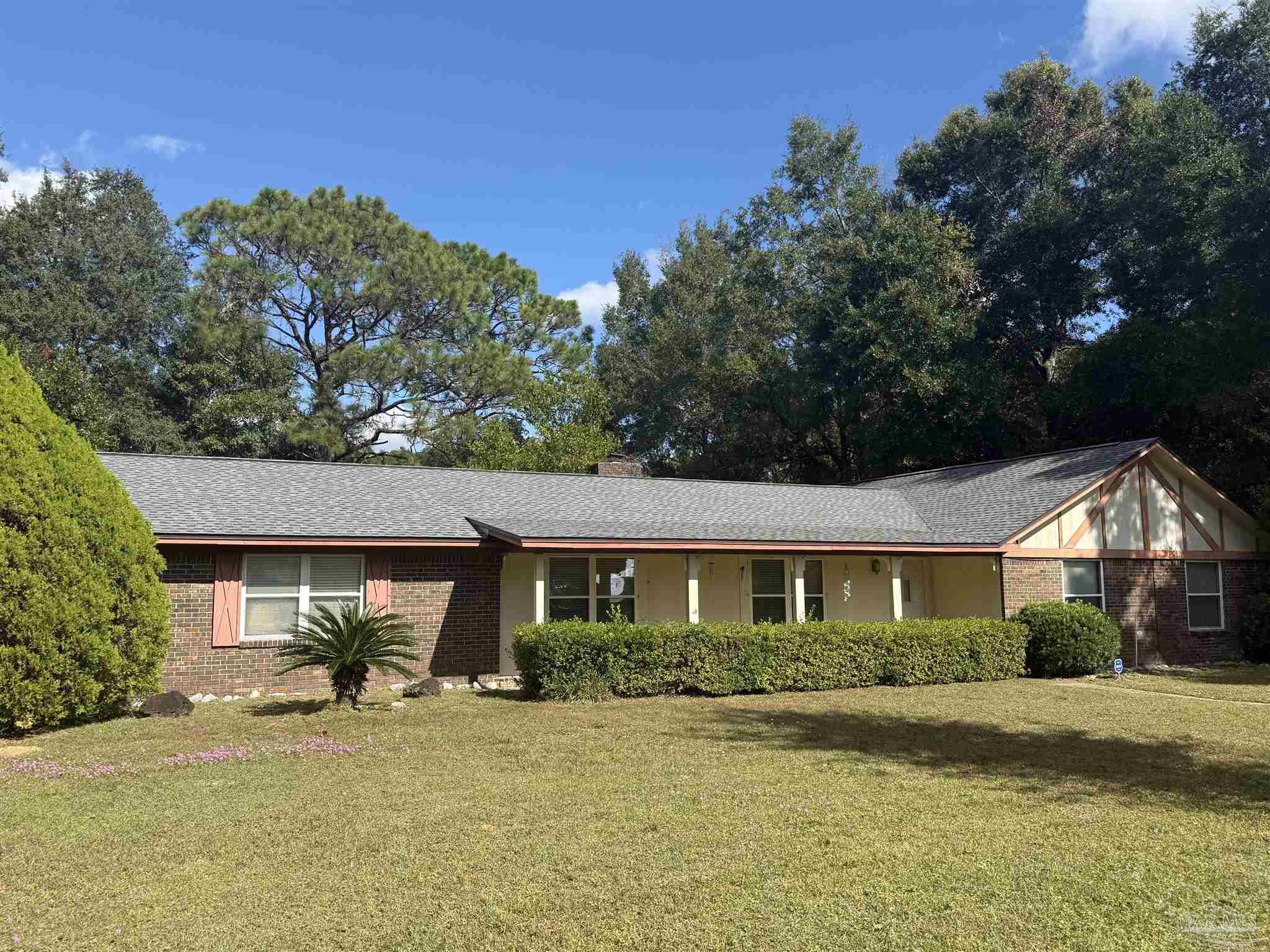 4112 Croydon Road Pensacola, FL 32514 - Photo 1 of 25 a view of a house with backyard and porch