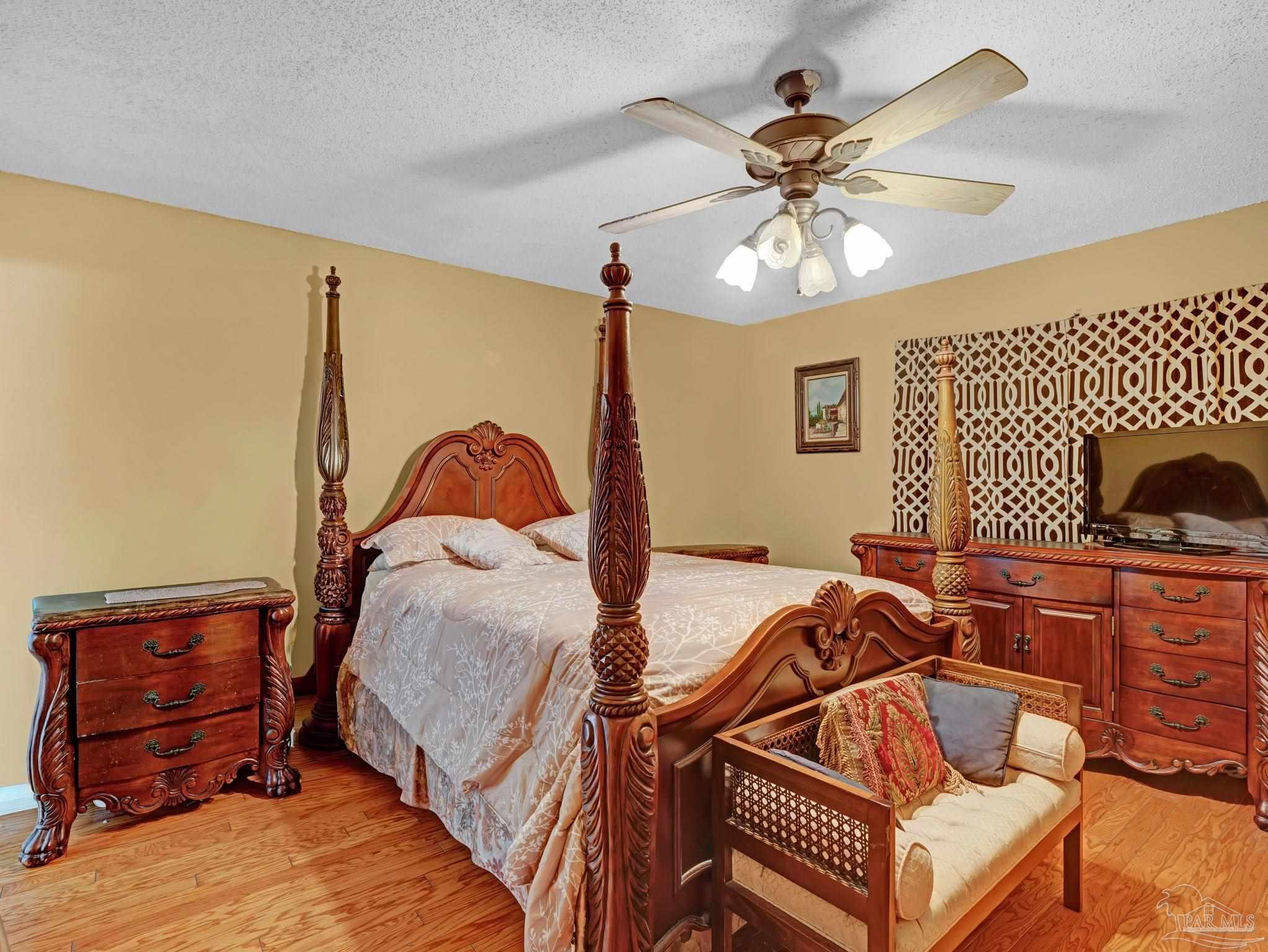 4112 Croydon Road Pensacola, FL 32514 - Photo 12 of 25 a bedroom with a bed and a dresser