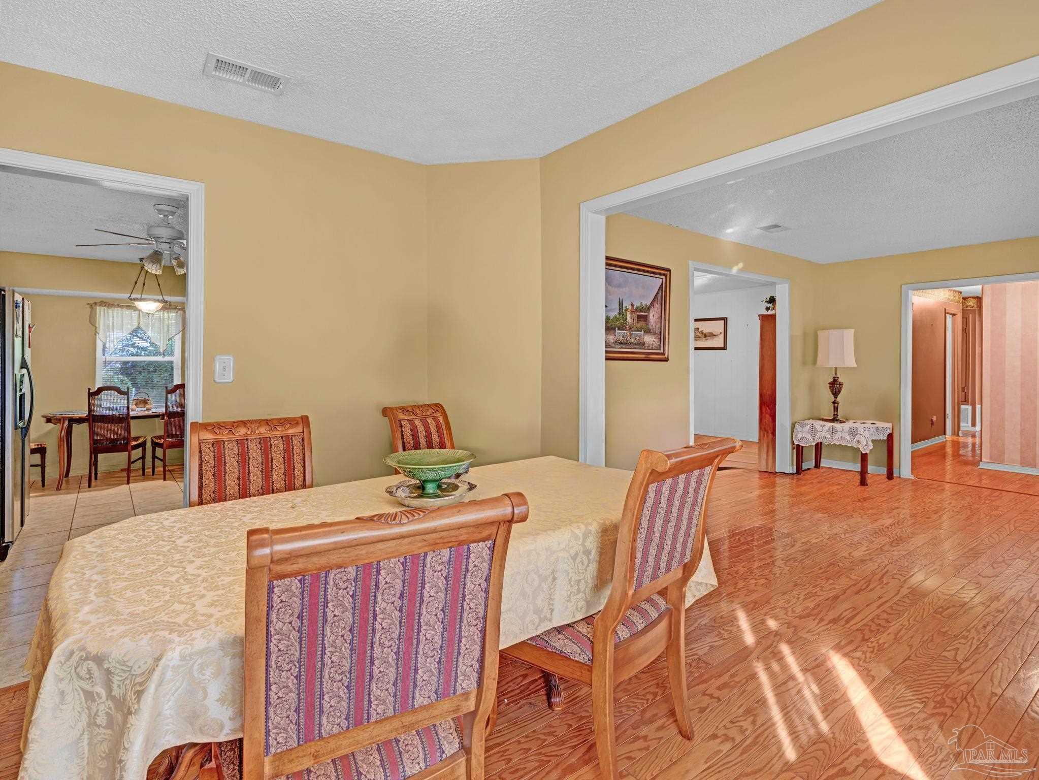 4112 Croydon Road Pensacola, FL 32514 - Photo 5 of 25 a bedroom with furniture and a wooden floor