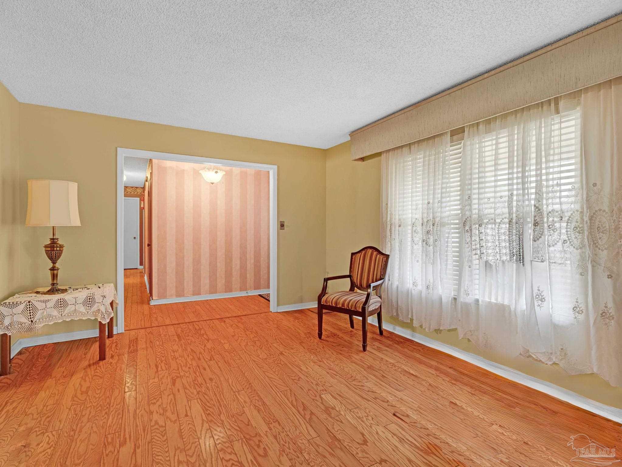 4112 Croydon Road Pensacola, FL 32514 - Photo 9 of 25 a living room with furniture and a window