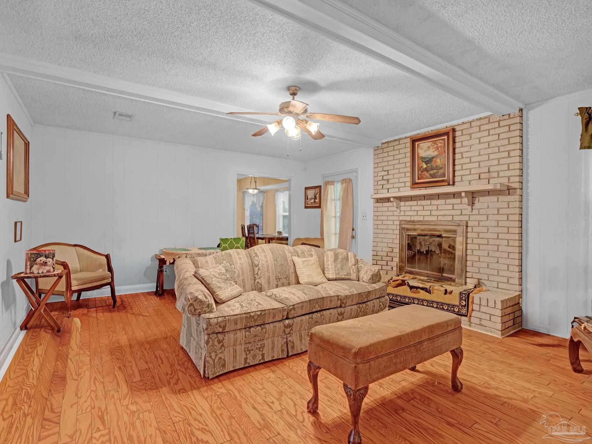 4112 Croydon Road Pensacola, FL 32514 - Photo 10 of 25 a living room with furniture and a fireplace